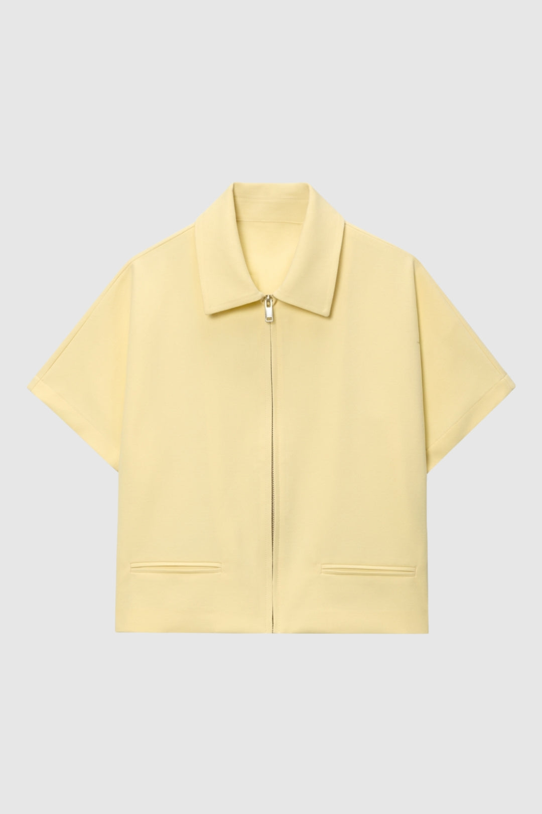 Krátké dámské sako s krátkým zipem, klopami, ležérní a elegantní