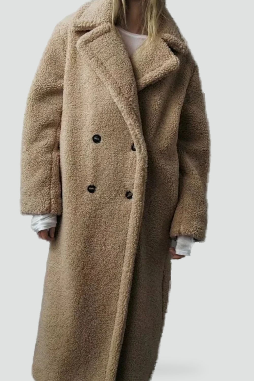 Luxe Teddy Coat, een zachte faux fur jas met teddy-textuur en een chique uitstraling.