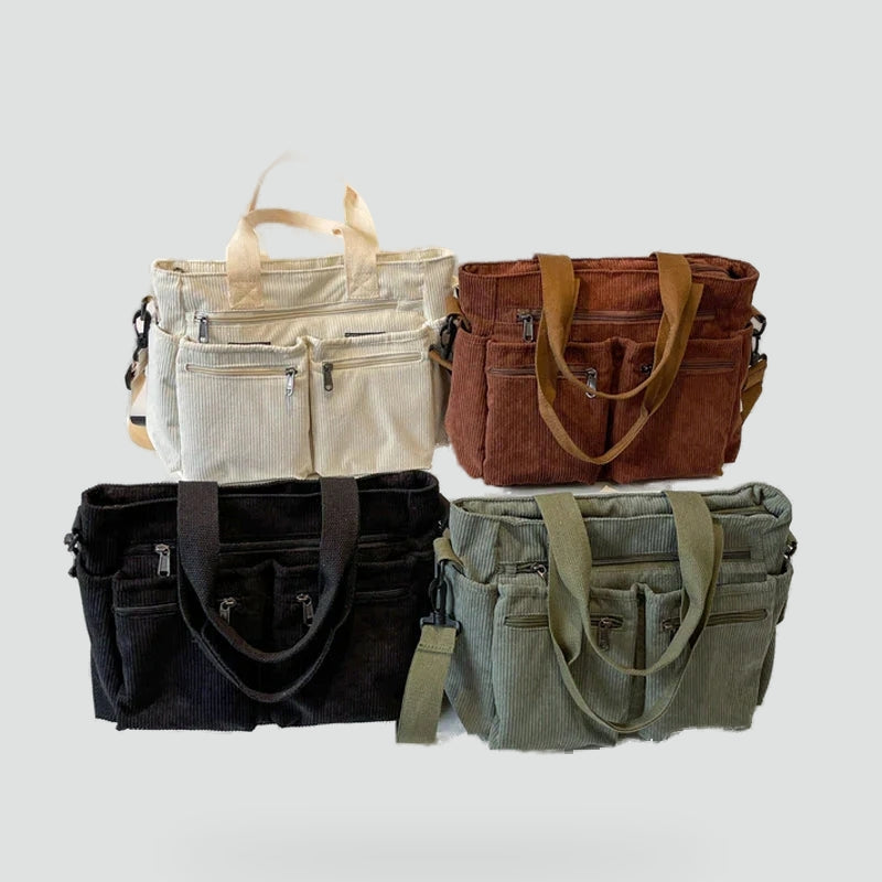 Urban Cord Tote in olijfgroen en zwart, gemaakt van zacht corduroy met meerdere vakken en veelzijdige draagopties – perfect voor dagelijks gebruik.